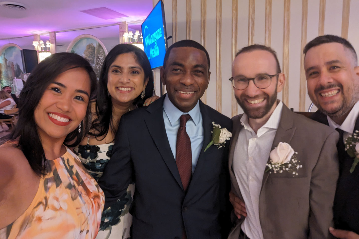 Three male and one female chief residents with administrative director, Camille Glotzbecker